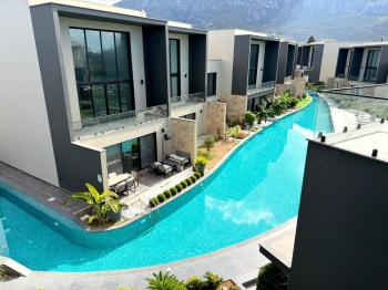 Kıbrıs Girne Kervansaray Projesi Deniz ve Havuz Manzaralı Satılık 3+1 Loft Daire