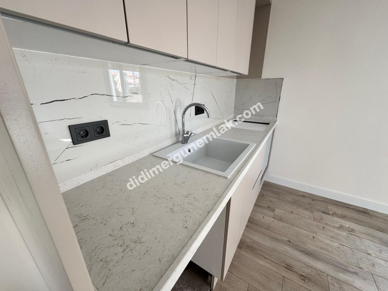 DİDİM YENİ MAHALLE’DE SIFIR, GİRİŞ KATTA, 2+1 SATILIK DAİRE