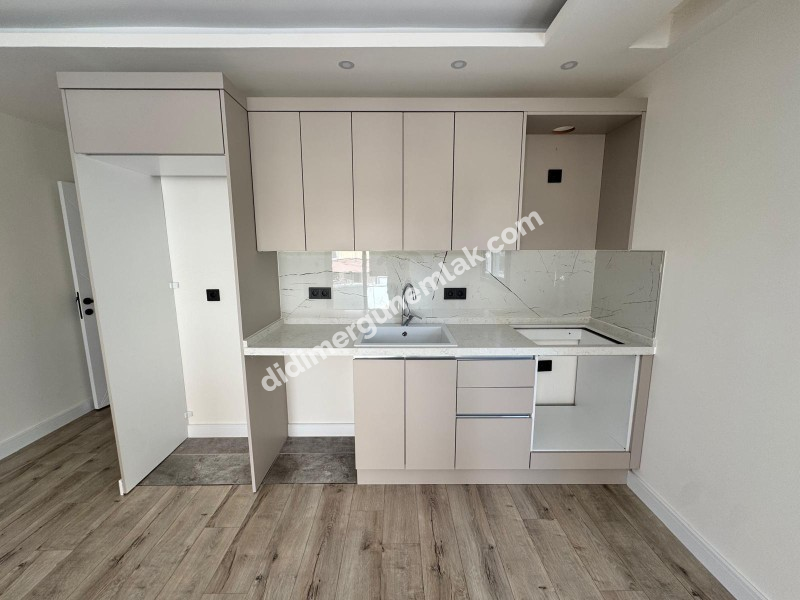 DİDİM YENİ MAHALLE’DE SIFIR, GİRİŞ KATTA, 2+1 SATILIK DAİRE