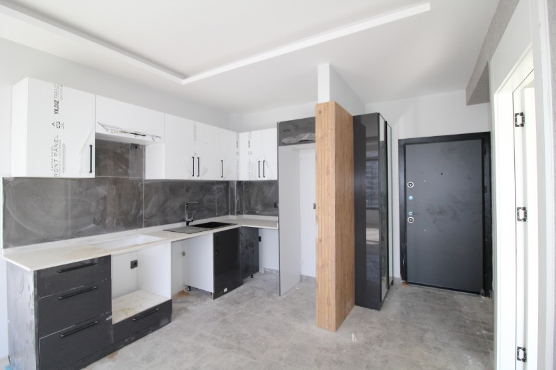 ASLAN'DAN TÖMÜK'TE SİTE İÇİ HAVUZLU SIFIR SATILIK 1+1