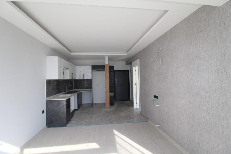 ASLAN'DAN TÖMÜK'TE SİTE İÇİ HAVUZLU SIFIR SATILIK 1+1