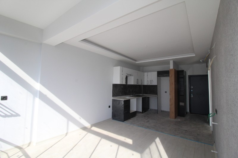 ASLAN'DAN TÖMÜK'TE SİTE İÇİ HAVUZLU SIFIR SATILIK 1+1