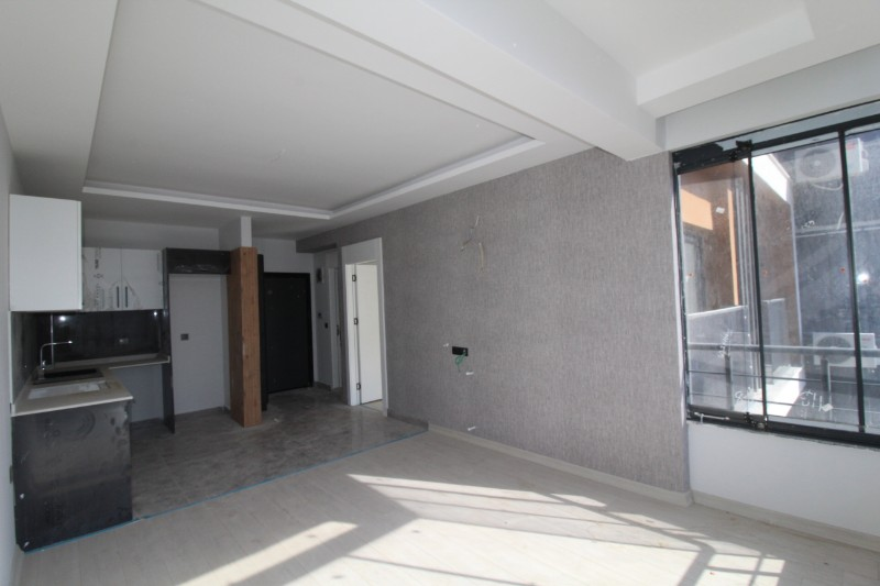 ASLAN'DAN TÖMÜK'TE SİTE İÇİ HAVUZLU SIFIR SATILIK 1+1