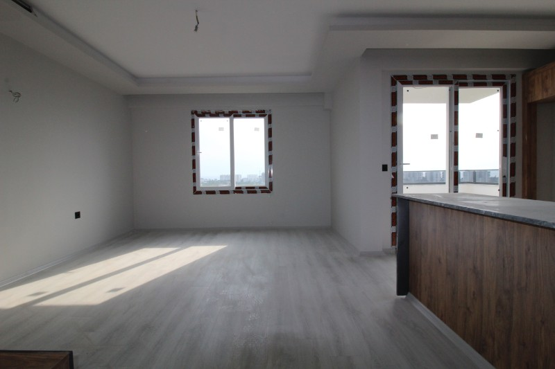 ASLAN'DAN DOĞA VE DENİZ MANZARALI GENİŞ METRAJLI SIFIR 2+1