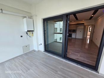 KUŞADASINDA DOGALĞAZLI HAVUZLU SATILIK 2+1DAİRE