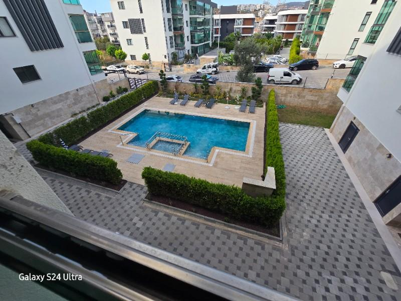 KUŞADASINDA DOGALĞAZLI HAVUZLU SATILIK 2+1DAİRE