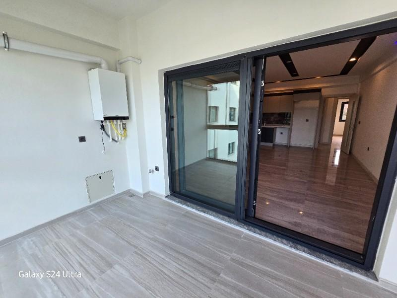 KUŞADASINDA DOGALĞAZLI HAVUZLU SATILIK 2+1DAİRE