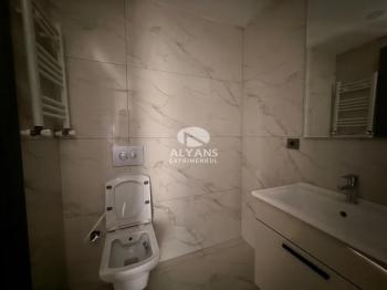 ALYANS'TAN YENİŞEHİR'DE TEK BLOK OTOPARKLI JENERATÖRLÜ 1+1