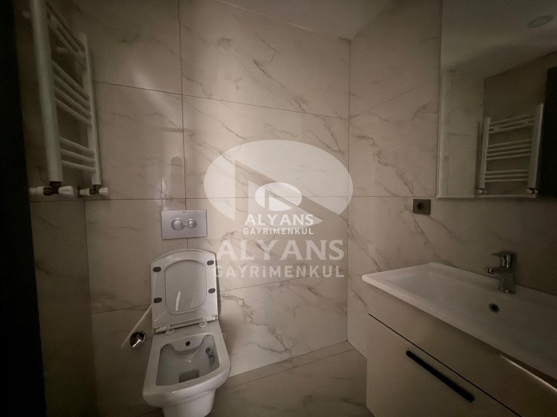 ALYANS'TAN YENİŞEHİR'DE TEK BLOK OTOPARKLI JENERATÖRLÜ 1+1