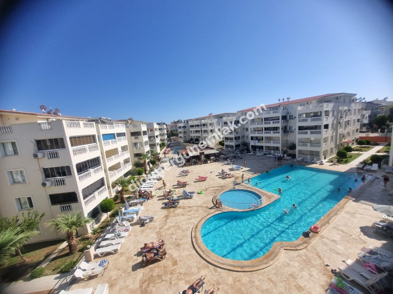  DİDİM ÇAMLIK MAHALLESİNDE EŞYALI SİTE İÇİNDE HAVUZ CEPHELİ FIRSAT 1+1 DAİRE