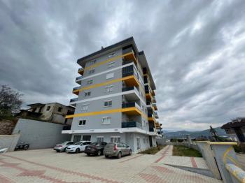 Alanya Demirtaš – na prodaju 2+1 stan sa odvojenom kuhinjom, 200 metara do mora, pogled na more