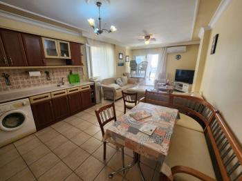 DİDİM ALTINKUM MAHALLESİNDE DENİZE 100 METRE AÇIK MUTFAKLI 2+1 SATILIK DAİRE