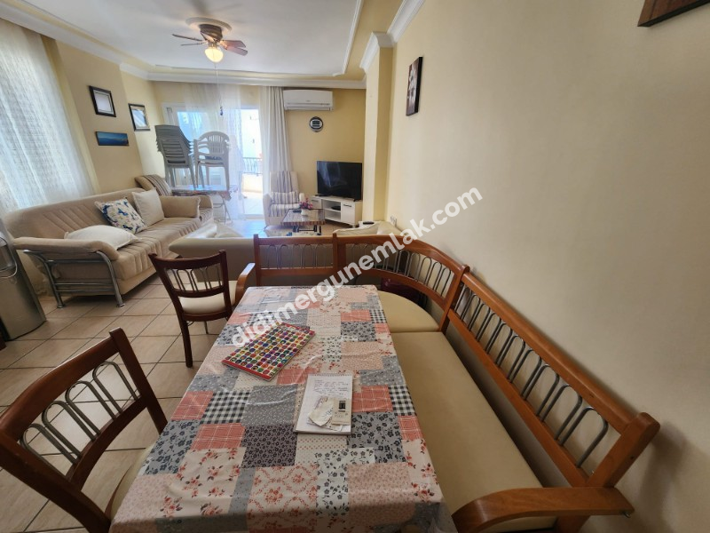 DİDİM ALTINKUM MAHALLESİNDE DENİZE 100 METRE AÇIK MUTFAKLI 2+1 SATILIK DAİRE