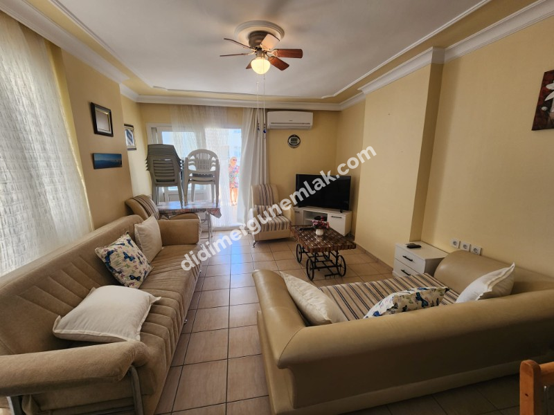 DİDİM ALTINKUM MAHALLESİNDE DENİZE 100 METRE AÇIK MUTFAKLI 2+1 SATILIK DAİRE