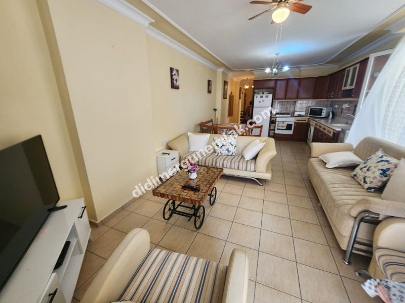 DİDİM ALTINKUM MAHALLESİNDE DENİZE 100 METRE AÇIK MUTFAKLI 2+1 SATILIK DAİRE