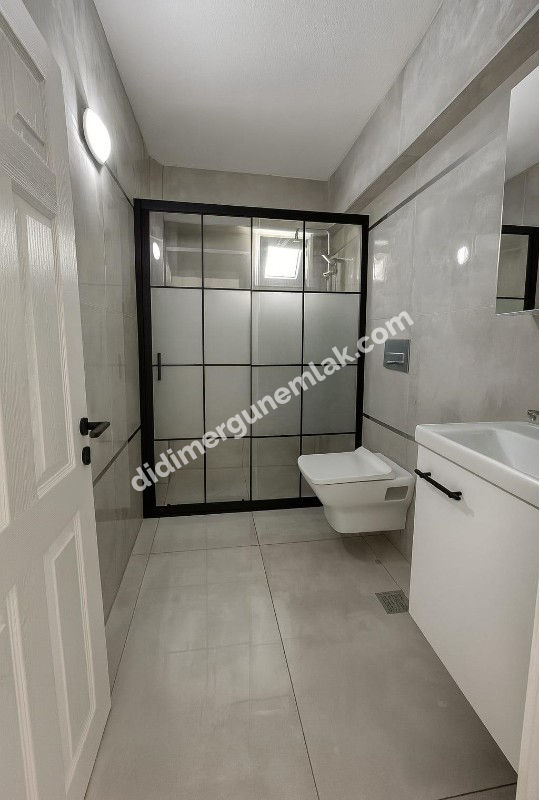 DİDİM ÇAMLIK MAHALLESİNDE DENİZE YÜRÜYÜŞ MESAFESİNDE,TAMAMEN YENİLENMİŞ EFSANE FİYATLI MASRAFSIZ VE ŞIK 2+1 SATILIK DAİRE!