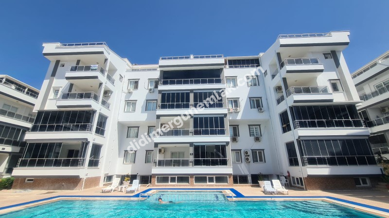 DİDİM EFELER MAHALLESİNDE HAVUZ CEPHELİ ,MODERN SİTEDE FERAH 2+1 SATILIK DAİRE