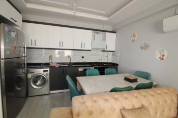 ASLAN'DAN KUYULUK'TA HAVUZLU SİTE İÇİ FULL EŞYALI KİRALIK 2+1