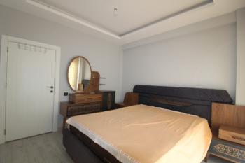 ASLAN'DAN KUYULUK'TA HAVUZLU SİTE İÇİ FULL EŞYALI KİRALIK 2+1