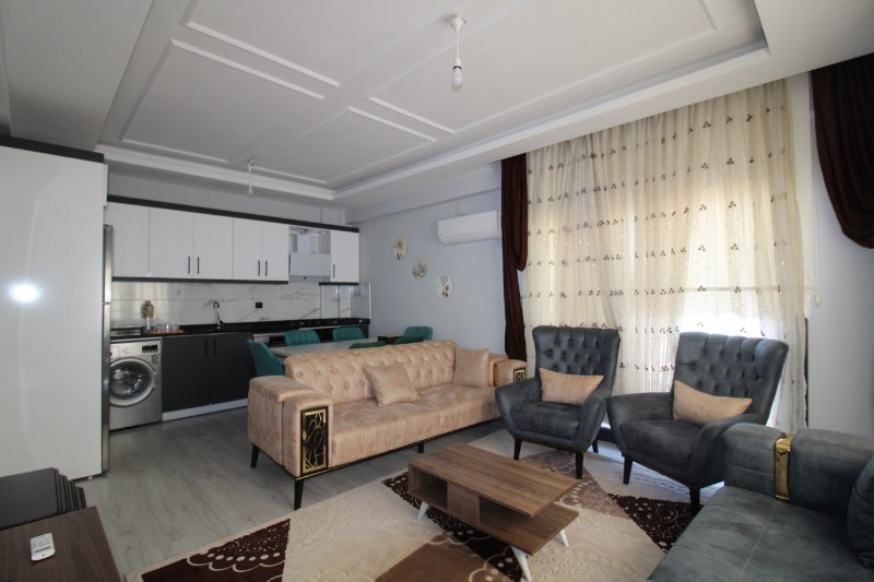 ASLAN'DAN KUYULUK'TA HAVUZLU SİTE İÇİ FULL EŞYALI KİRALIK 2+1