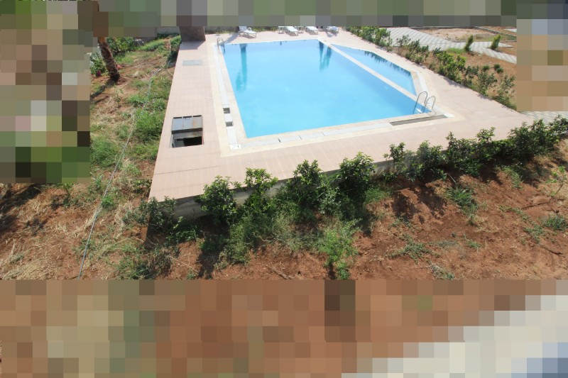 ASLAN'DAN KUYULUK'TA HAVUZLU SİTE İÇİ FULL EŞYALI KİRALIK 2+1