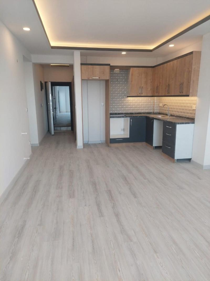 KUŞADASINDA DENİZ MANZARALI HAVUZLU SATILIK 2+1DAİRELER