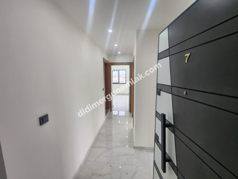 DİDİM EFELER MAHALLESİNDE STADYUM BÖLGESİNDE DENİZE YÜRÜME MESAFESİNDE SIFIR 2+1 SARTILIK DAİRE