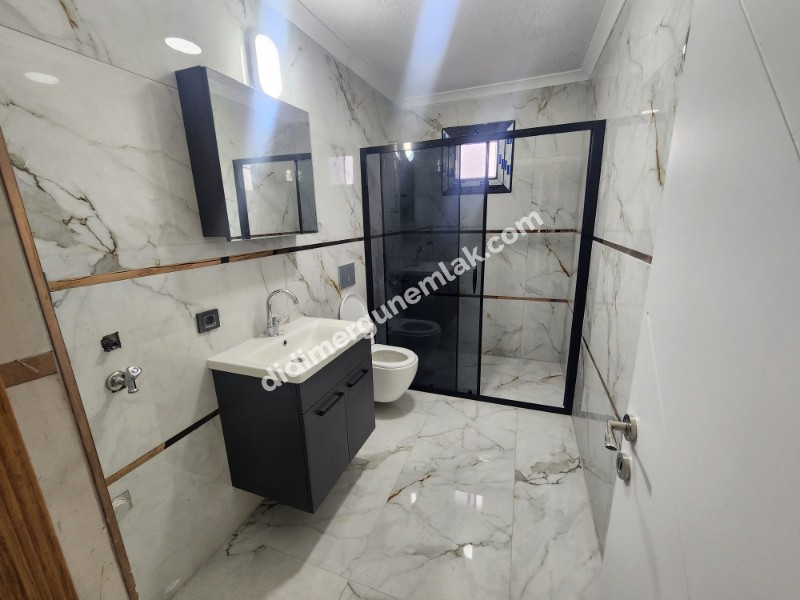 DİDİM EFELER MAHALLESİNDE STADYUM BÖLGESİNDE DENİZE YÜRÜME MESAFESİNDE SIFIR 2+1 SARTILIK DAİRE