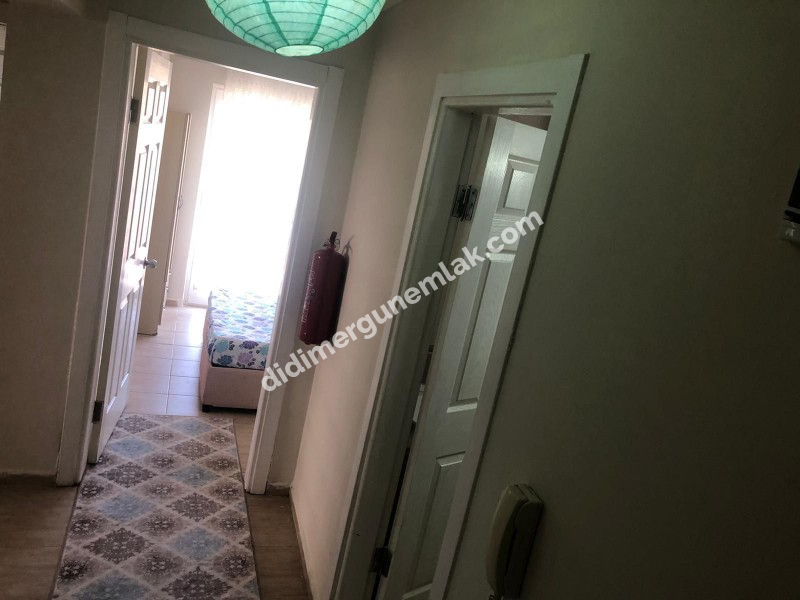 DİDİM ALTINKUM MAHALLESİ' NDE HAVUZLU SİTE İÇERİSİNDE ASANSÖRLÜ 2. KATTA 2+1 EŞYALI SATILIK DAİRE