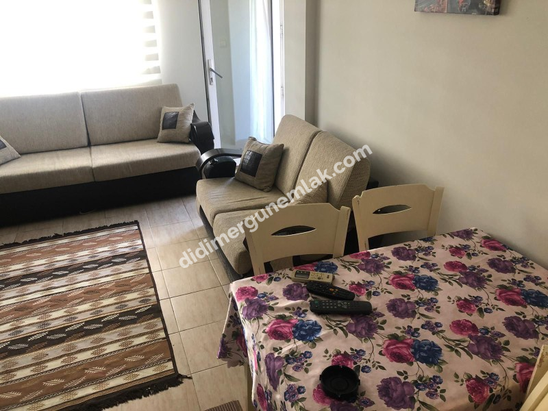DİDİM ALTINKUM MAHALLESİ' NDE HAVUZLU SİTE İÇERİSİNDE ASANSÖRLÜ 2. KATTA 2+1 EŞYALI SATILIK DAİRE