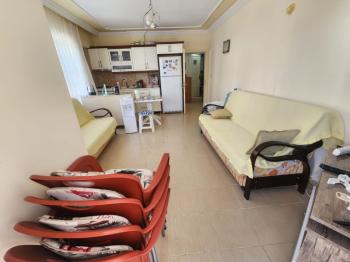DİDİM ÇAMLIK MAHALLESİNDE EGE CADDESİNDE 1. KAT • 2+1 EŞYALI • 16 YAŞINDA • 75 m² • GENİŞ BALKONLU • BATI CEPHELİ • CADDEYE VE 2 YOLA CEPHELİ SATILIK DAİRE