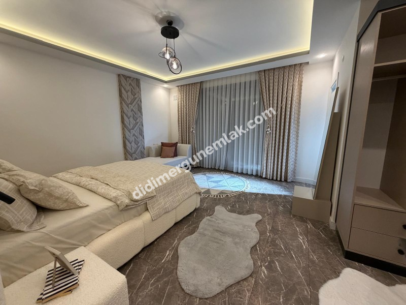 DİDİM HİSAR MAHALLESİNDE 300 m² ARSA İÇERİSİNDE TAM MÜSTAKİL, 4+1 AÇIK MUTFAK, LÜKS MİMARİ TASARIMA SAHİP, FULL LÜKS EŞYALI, KLİMALI, İSKANLI VE KAT MÜLKİYETLİ SATILIK VİLLA