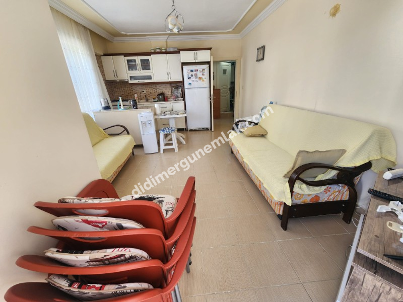 DİDİM ÇAMLIK MAHALLESİNDE EGE CADDESİNDE 1. KAT • 2+1 EŞYALI • 16 YAŞINDA • 75 m² • GENİŞ BALKONLU • BATI CEPHELİ • CADDEYE VE 2 YOLA CEPHELİ SATILIK DAİRE