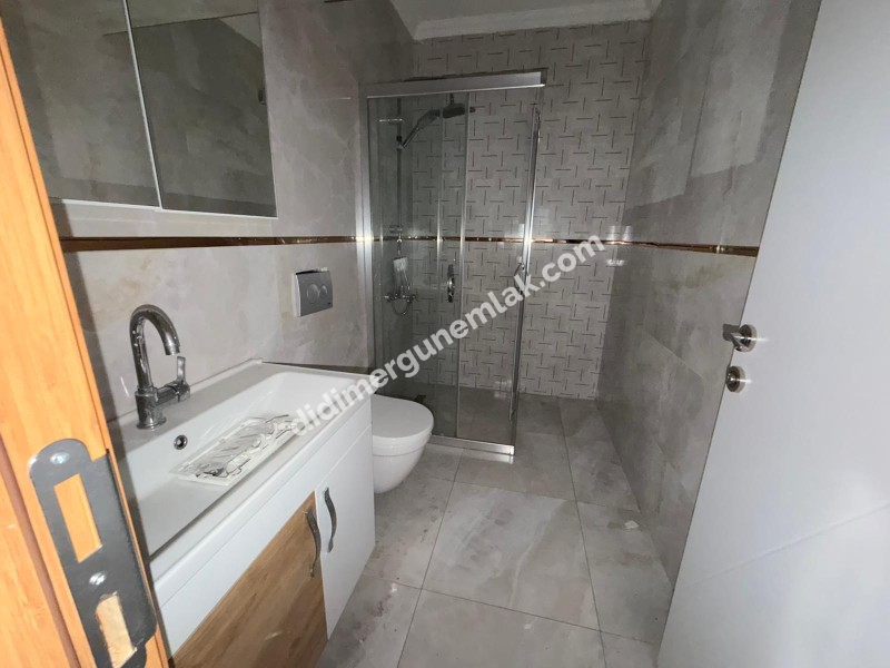 DİDİM YENİ MAHALLE’DE 115M² NET ALANA SAHİP 3+1 AYRI MUTFAKLI, ÖNÜ OTOPARKLI GENİŞ VE FERAH ODALI, BALKONLU ARA KAT SATILIK DAİRE