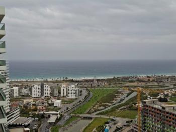 İSKEKLE LONGBEACH BÖLGESİNDE 7 YILDIZLI REZİDANS İLE OTEL KONSEPTLİ SATILIK 2+1 DAİRE