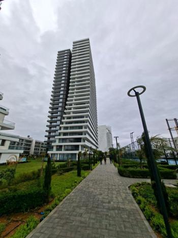 İSKEKLE LONGBEACH BÖLGESİNDE 7 YILDIZLI REZİDANS İLE OTEL KONSEPTLİ SATILIK 2+1 DAİRE