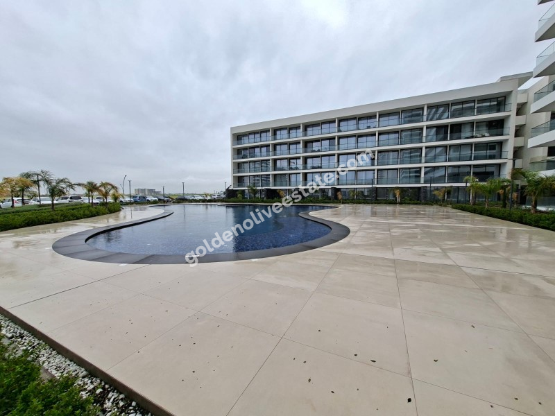 İSKEKLE LONGBEACH BÖLGESİNDE 7 YILDIZLI REZİDANS İLE OTEL KONSEPTLİ SATILIK 2+1 DAİRE