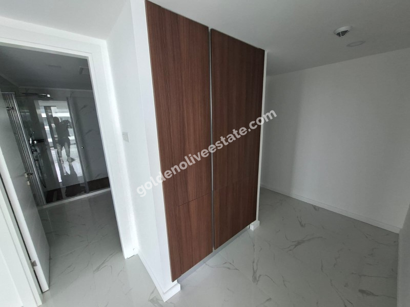 İSKEKLE LONGBEACH BÖLGESİNDE 7 YILDIZLI REZİDANS İLE OTEL KONSEPTLİ SATILIK 2+1 DAİRE