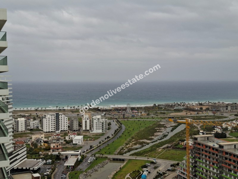 İSKEKLE LONGBEACH BÖLGESİNDE 7 YILDIZLI REZİDANS İLE OTEL KONSEPTLİ SATILIK 2+1 DAİRE