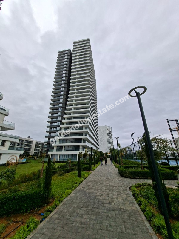 İSKEKLE LONGBEACH BÖLGESİNDE 7 YILDIZLI REZİDANS İLE OTEL KONSEPTLİ SATILIK 2+1 DAİRE