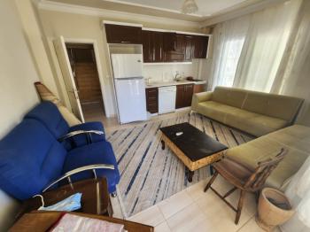 DİDİM ALTINKUM MAHALLESİ' NDE DENİZE YÜRÜME MESAFESİNDE 4 BALKONLU-PARK CEPHELİ  EŞYALI 2+1 SATILIK DAİRE