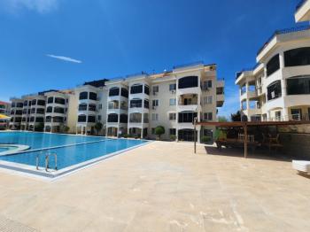 ÇAMLIK MAHALLESİ’NDE HAVUZLU SİTE İÇERİSİNDE 2+1 EŞYALI YÜKSEK ZEMİN KAT SATILIK DAİRE