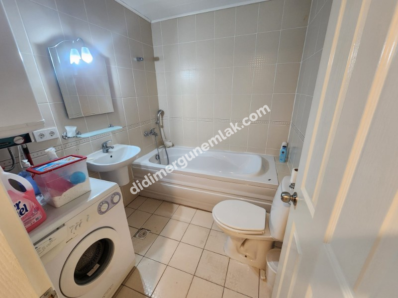 ÇAMLIK MAHALLESİ’NDE HAVUZLU SİTE İÇERİSİNDE 2+1 EŞYALI YÜKSEK ZEMİN KAT SATILIK DAİRE