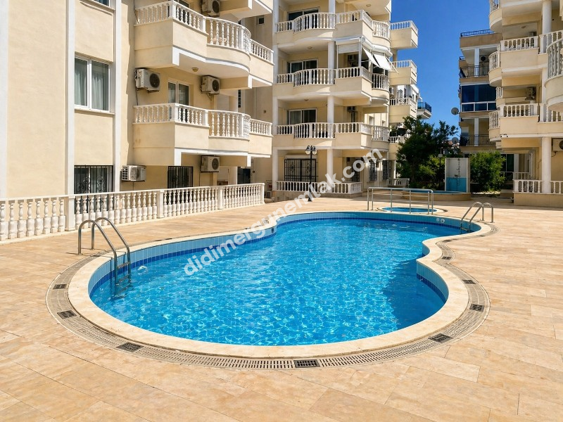 ALTINKUM MAHALLESİ’NDE HAVUZLU SİTE İÇERİSİNDE EŞYALI, 3+1 SATILIK DAİRE! DENİZE YÜRÜME MESAFESİNDE!