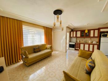 ALTINKUM PLAJI’NA YÜRÜME MESAFESİNDE GENİŞ 2+1 EŞYALI DAİRE FIRSATI