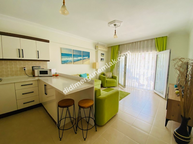 ALTINKUM’DA HAVUZLU SİTE İÇERİSİNDE FULL EŞYALI 2+1 DAİRE