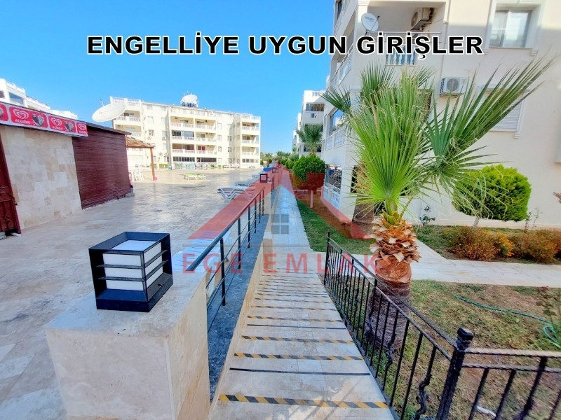 Didim Çamlık'ta Ünlü Royal Marina Complex İçinde Satılık Havuz Gören Eşyalı Giriş Kat Daire