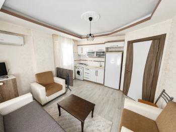 Didim Hisar Mahallesi’nde Eşyalı Satılık 1+1 Ara Kat Daire