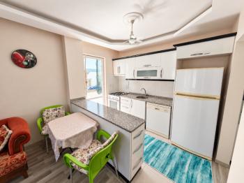 Didim Yeni Mahalle Deniz Evleri'nde Park Cepheli Geniş Balkonlu 2+1 Satılık Daire